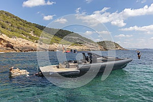 People in relax on theinflatable motor boat in formentera, spain