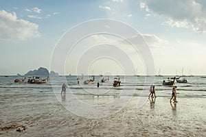 People relax and walking at Ao Nang beach before the sunset