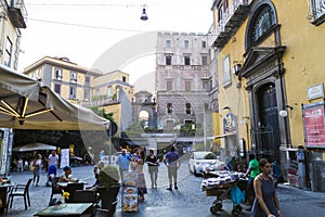 People relaxing and having a good tine on a terrace, ambulant merchant and tourist photo