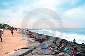 People relaxing at sunset on promenade beach pondicherry