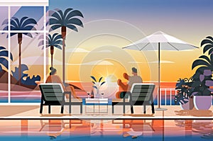 people relaxing at tropical luxury resort hotel beach swimming pool and poolside seating area summer vacation concept