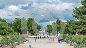 People relaxing in Tuileries Palace open air park near museum timelapse. Paris, France