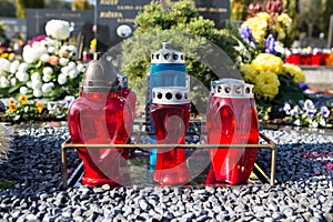 People remembering their loved ones who died; on the cemetery