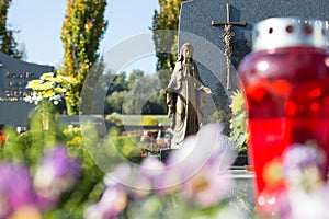 People remembering their loved ones who died; on the cemetery