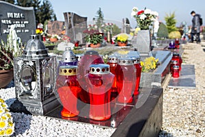 People remembering their loved ones who died; on the cemetery