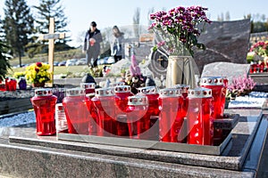 People remembering their loved ones who died; on the cemetery