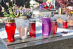 People remembering their loved ones who died; on the cemetery