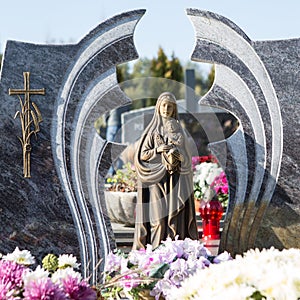 People remembering their loved ones who died; on the cemetery