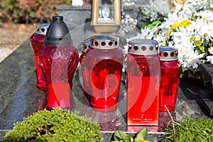 People remembering their loved ones who died; on the cemetery