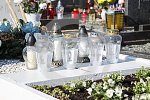 People remembering their loved ones who died; on the cemetery