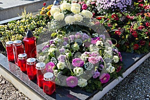 People remembering their loved ones who died; on the cemetery