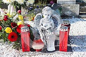 People remembering their loved ones who died; on the cemetery