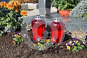 People remembering their loved ones who died; on the cemetery