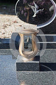 People remembering their loved ones who died; on the cemetery