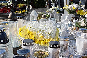 People remembering their loved ones who died; on the cemetery