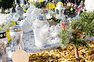 People remembering their loved ones who died; on the cemetery