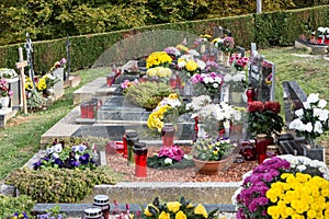 People remembering their loved ones who died on the cemetery