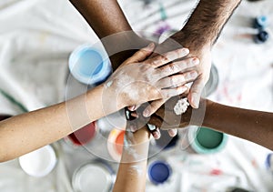 People renovating the house joining hands together