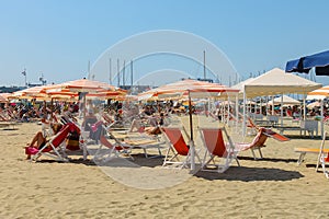 People resting on the beach in Viareggio, Italy