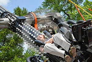 People ride rides in an amusement Park.