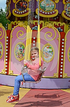 People ride rides in an amusement Park.