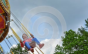 People ride rides in an amusement Park.