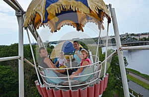 People ride rides in an amusement Park.