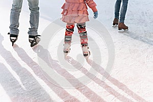 People ride on the skating rink on the ice rink during the Christmas holidays.