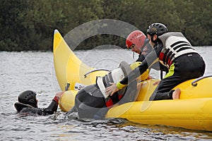 People riding on a banana boat