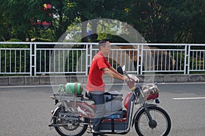 People riding bicycles or electric bicycles.