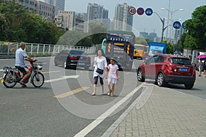 People riding bicycles or electric bicycles.