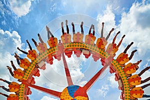 People riding with fun on extreme attraction in amusement park