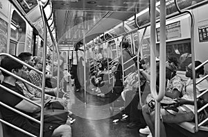 People Riding Inside of Subway Car Train New York City MTA Crowded Commute