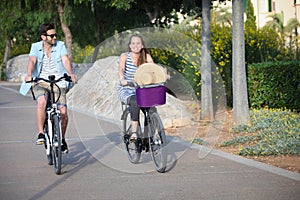 People riding rental or hire bikes