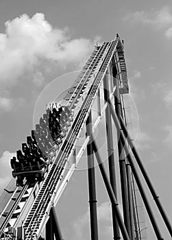 People riding roller coaster background