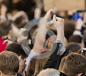 People ringing keys on the demonstration on Prague Wenceslas square against the current government and Babis