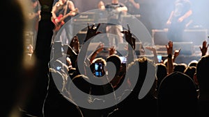 People at the Rock Concert, Broadcast Live on Social Networks Using a Smartphone