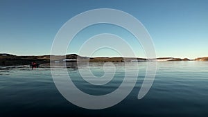 People in a rubber boat in Ocean on New Earth Vaigach.