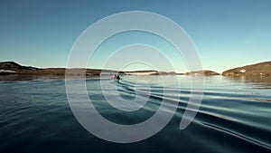 People in a rubber boat in Ocean on New Earth Vaigach.