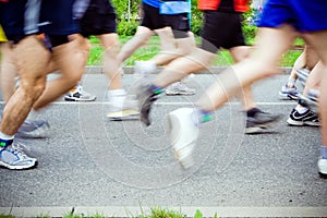 People running in city marathon, sport shoes