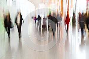 People Rushing at Airport in Motion Blur