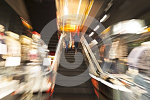 People rushing through corridor, zoom effect