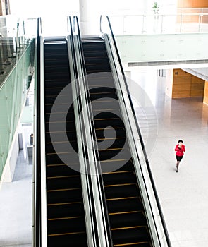 People rushing on escalator photo