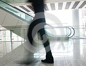 People rushing on escalator photo