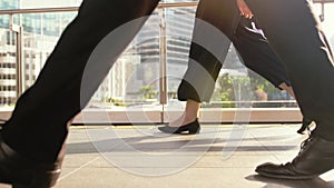 People`s feet walk on pedestrian crossing on a busy day in the center of the city on a sunny day on the road on the