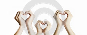 People`s hands show a heart sign. Valentines day relationship concept. On isolated background