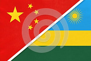 China or PRC vs Rwanda national flag from textile. Relationship between Asian and African countries photo