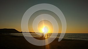 People seeing the Sunset on the beach