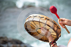 People are seen playing percussion instruments during a party for Iemanja on Rio Vermelho beach in the city of Salvador, Bahia