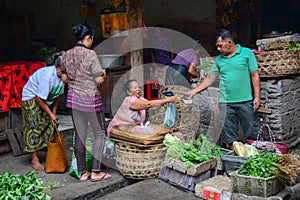 People sell vegetables at the local market in Bali, Indonesia